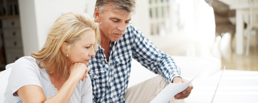 Couple reviewing paperwork together