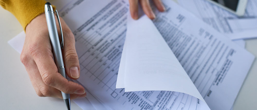 A person holding a piece of paper